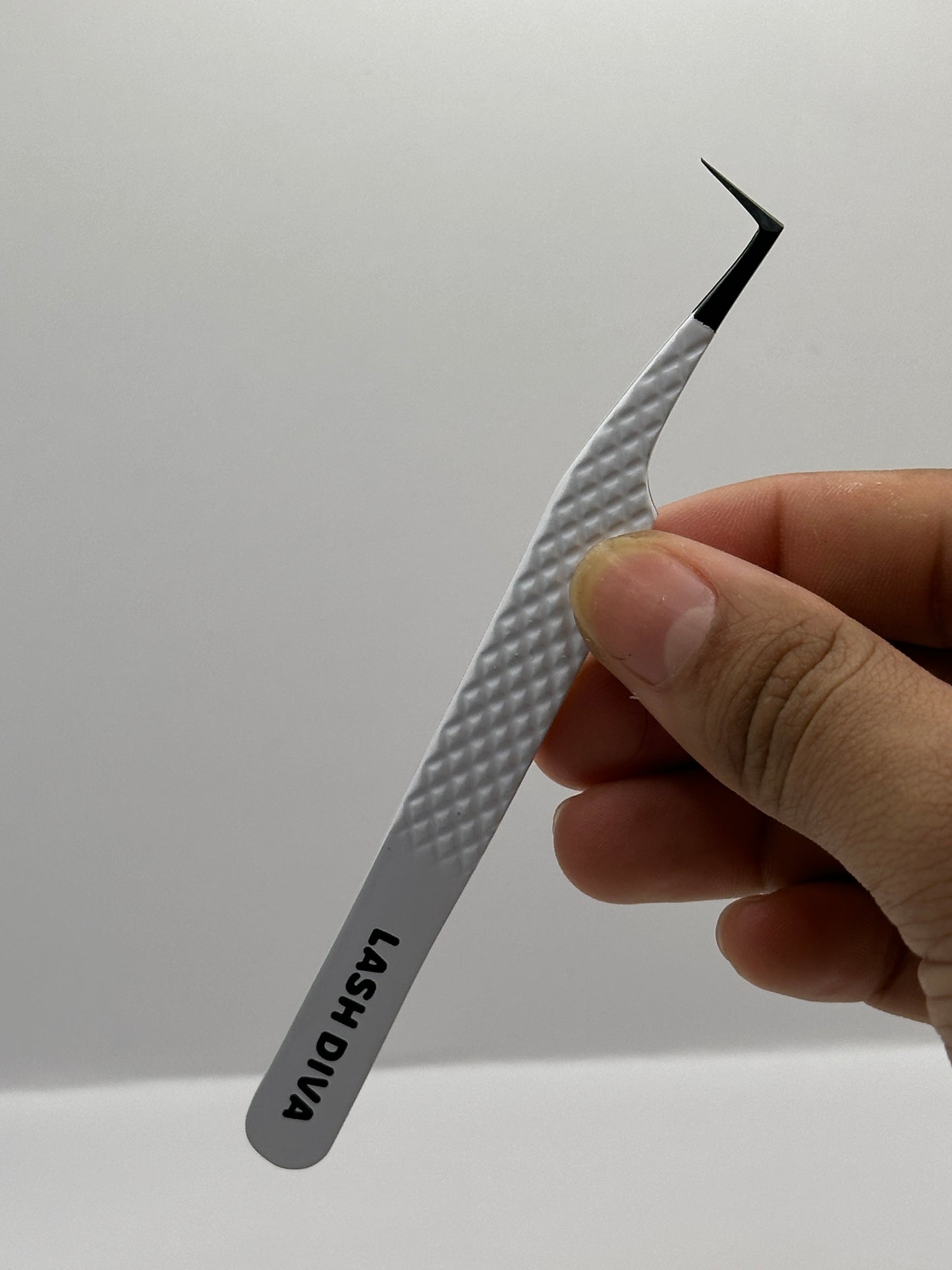 Volume booth tweezers